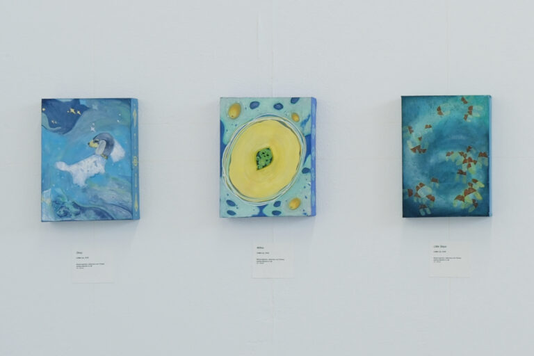 A group view of three small framed paintings on silk—Stray, Little Steps and Within—displayed together on a white wall.
