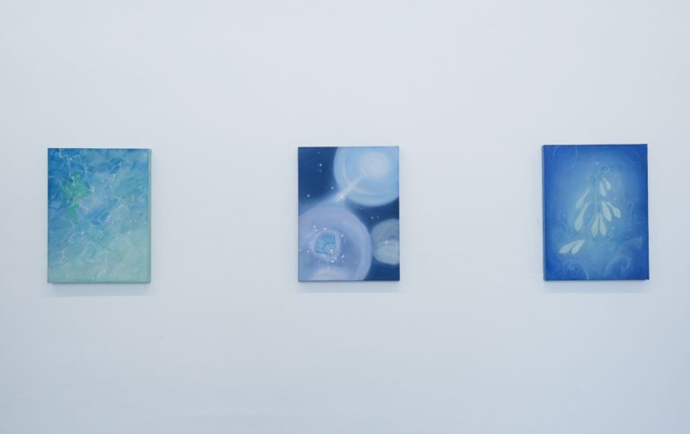 A group view of three paintings on silk from the A New World series, displayed together as connected observations of pareidolia.