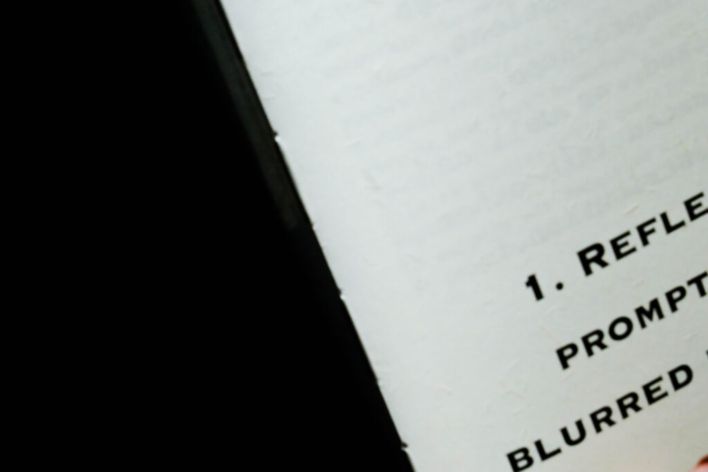 Inner page detail showing the subtle fibrous texture of the ultra-white paper and the printed typography.