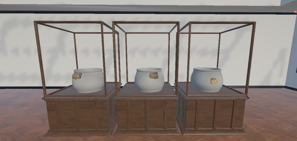 VR museum scene showing three prehistoric pottery fragments displayed on low-detail vessel references in separate cases.