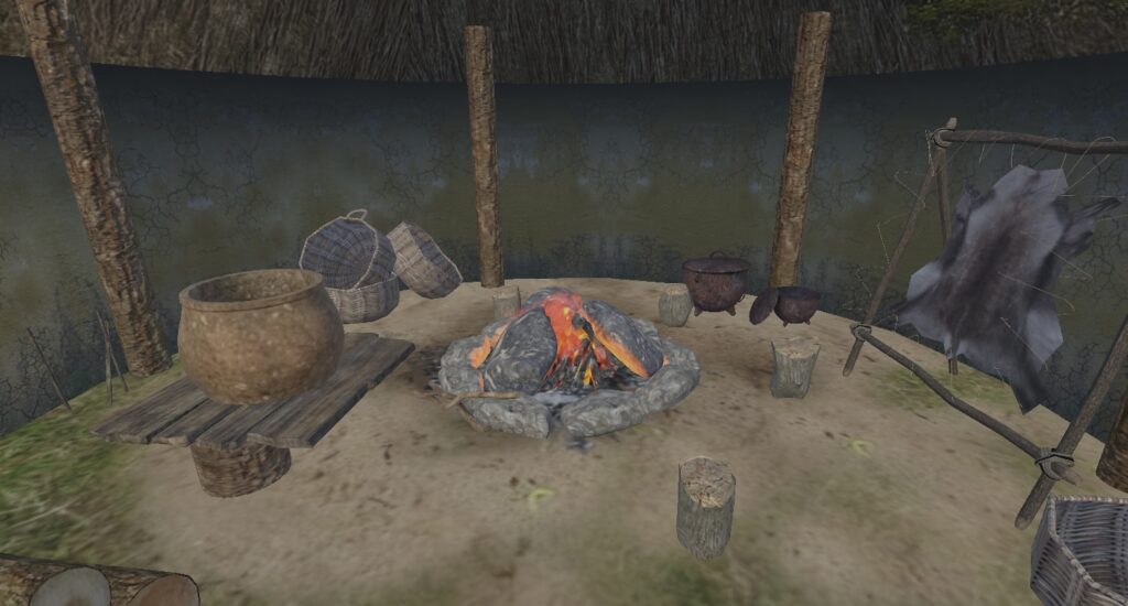 VR view of an interpretative Crannog interior with a pottery vessel beside a central hearth and surrounding domestic objects.