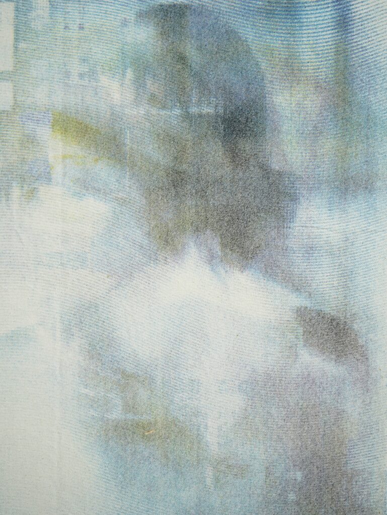 Detail view of A Slow Vanishing, 2026, showing pale layered screenprinted imagery, soft blue-grey tones and partially obscured forms on canvas.