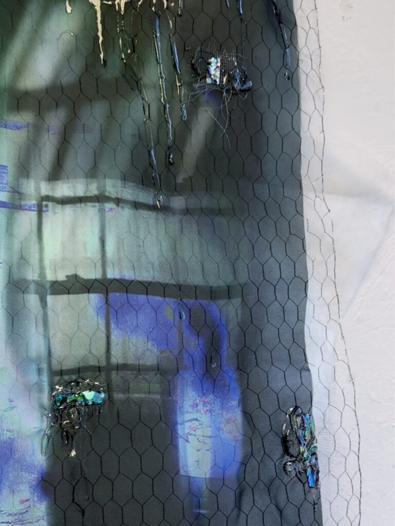 Detail view of Blue Hush, 2026, showing layered blue-toned imagery, fragmented forms and textured mixed-media surfaces.